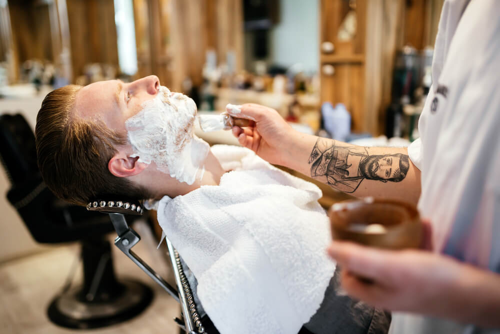 How can men lessen the irritating effects of shaving